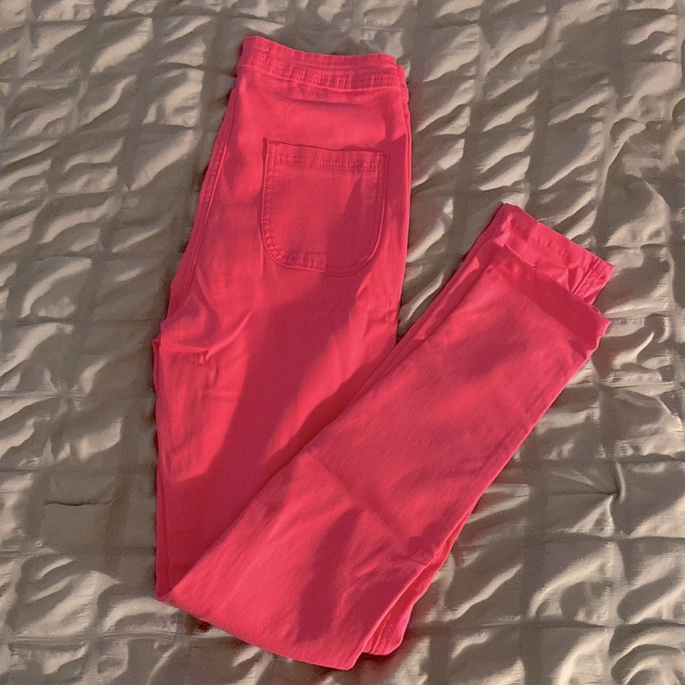 Neon Pink High-Waisted Jeans.